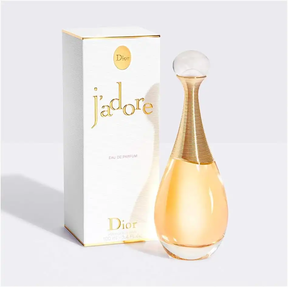 Frasco do Dior J'adore Eau de Parfum dourado ao lado da caixa